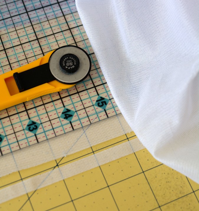 knit interfacing cut into thin strips to stabilize seams for sewing on a regular ole sewing machine!
